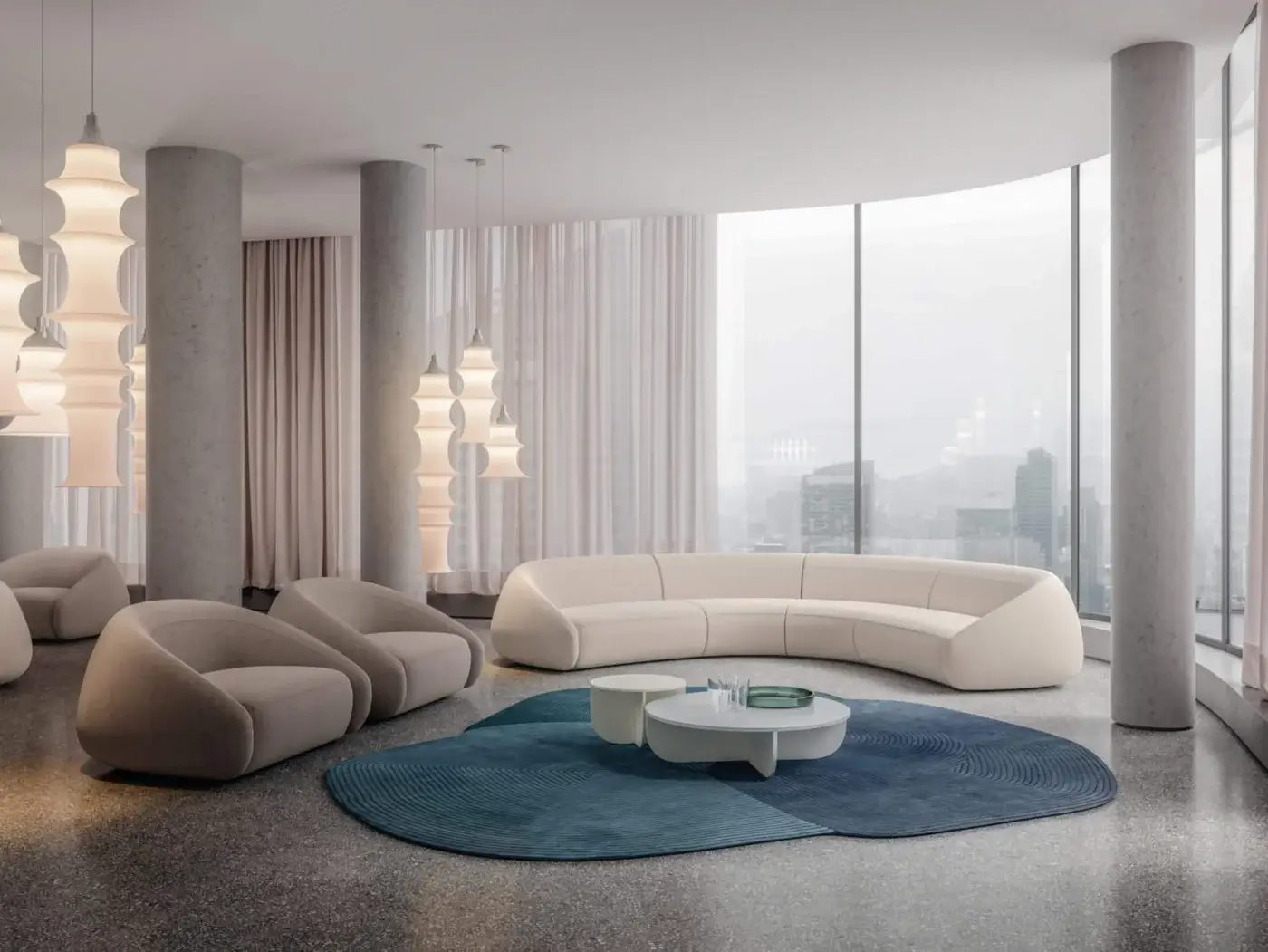 Off-white modular sofa with La Cividina "apper lounge chairs" in a modern living room featuring a teal rug and terrazzo floor.