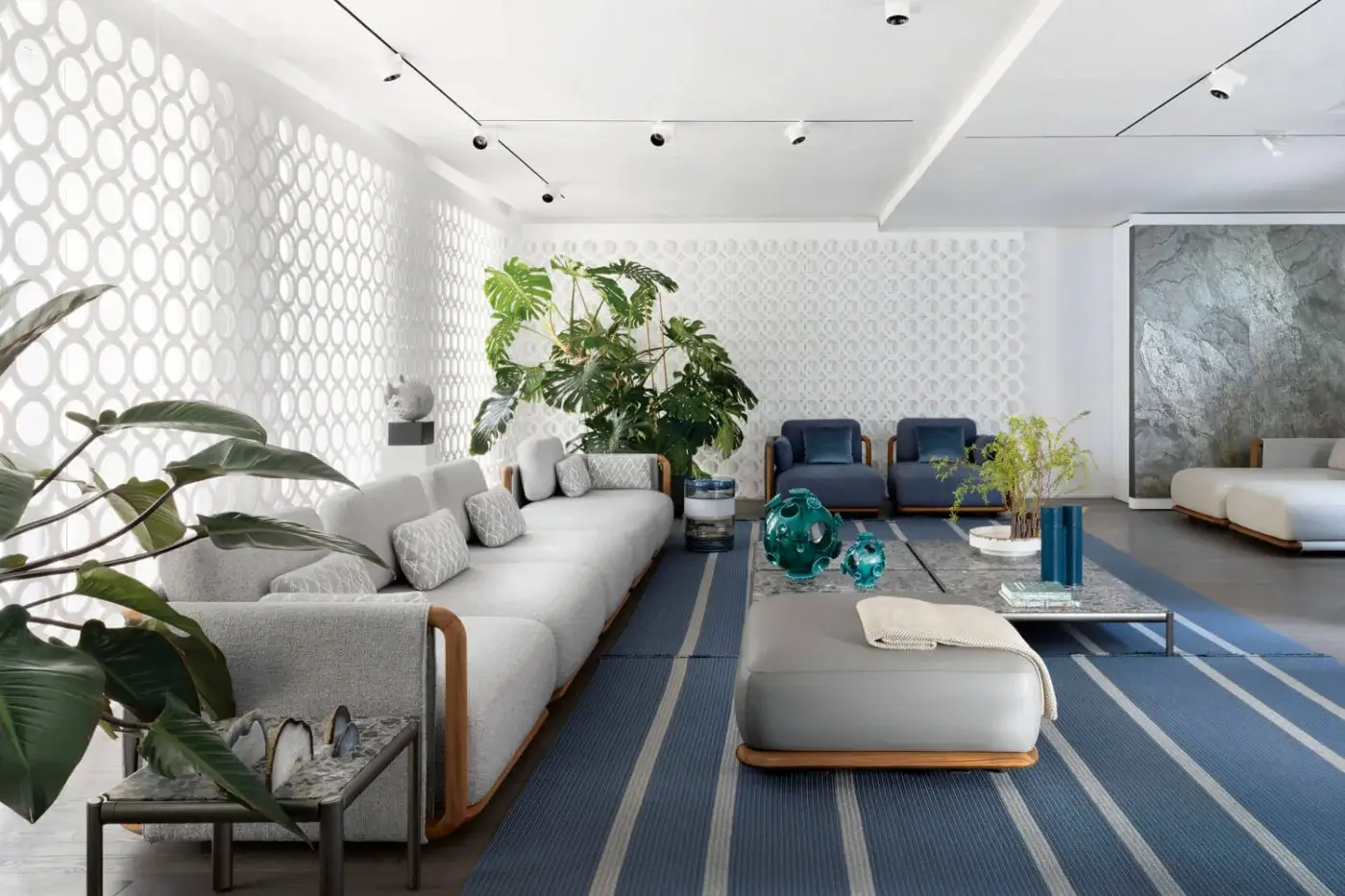 Lavish Giorgetti Moorea sectional with pewter painted stainless steel, teak inserts and textured light gray fabric upholstery