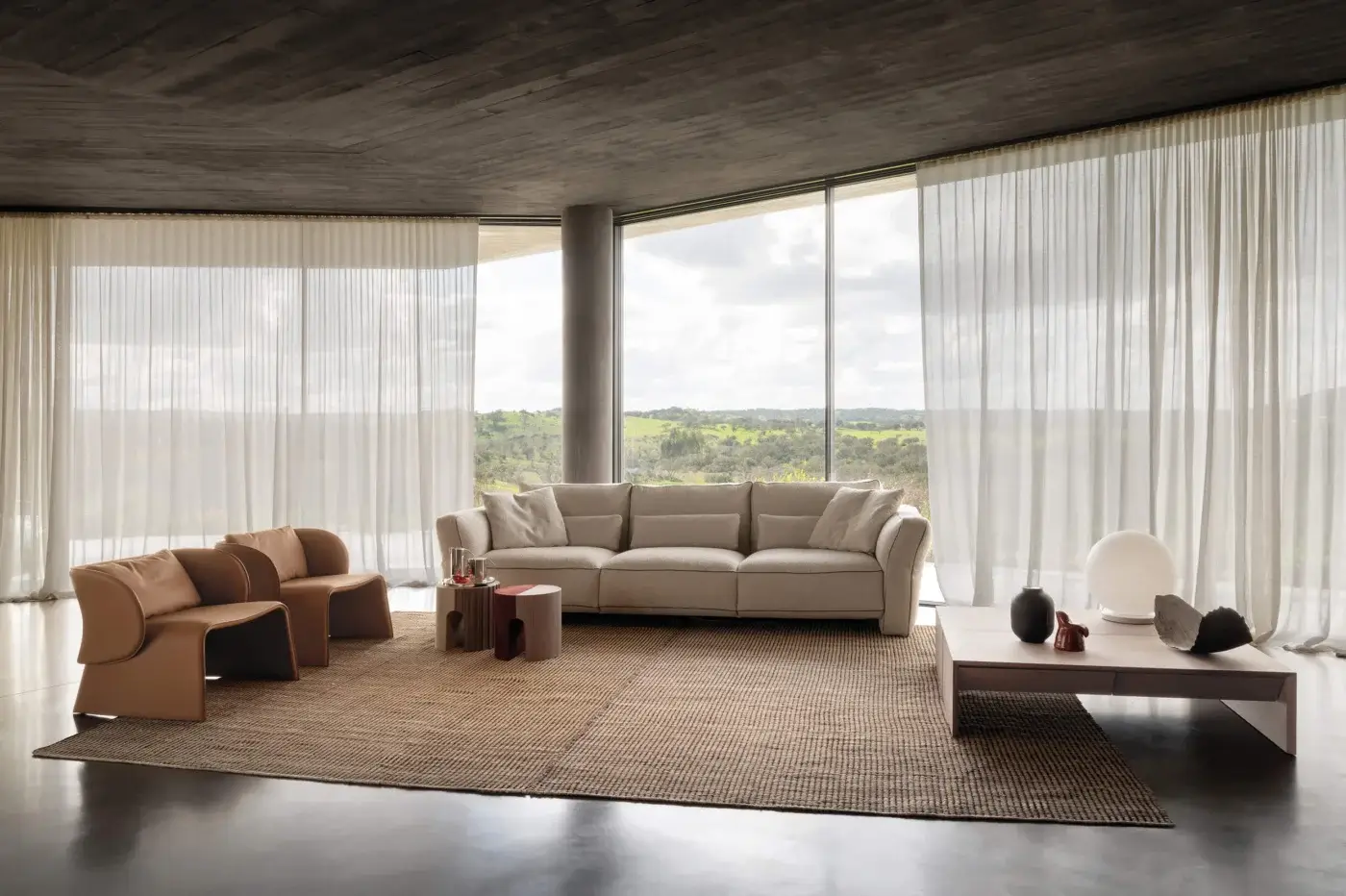 Captivating Cierre1972 Loden sofa with textured beige textile upholstery and elegant leather piping details