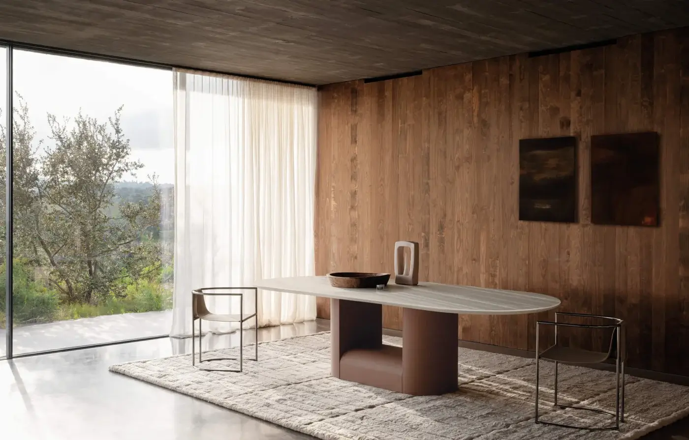 Distinguished Cierre1972 Samoa table crafted in Italy with a composite stone tabletop and leather base exhibiting a minimalist aesthetic