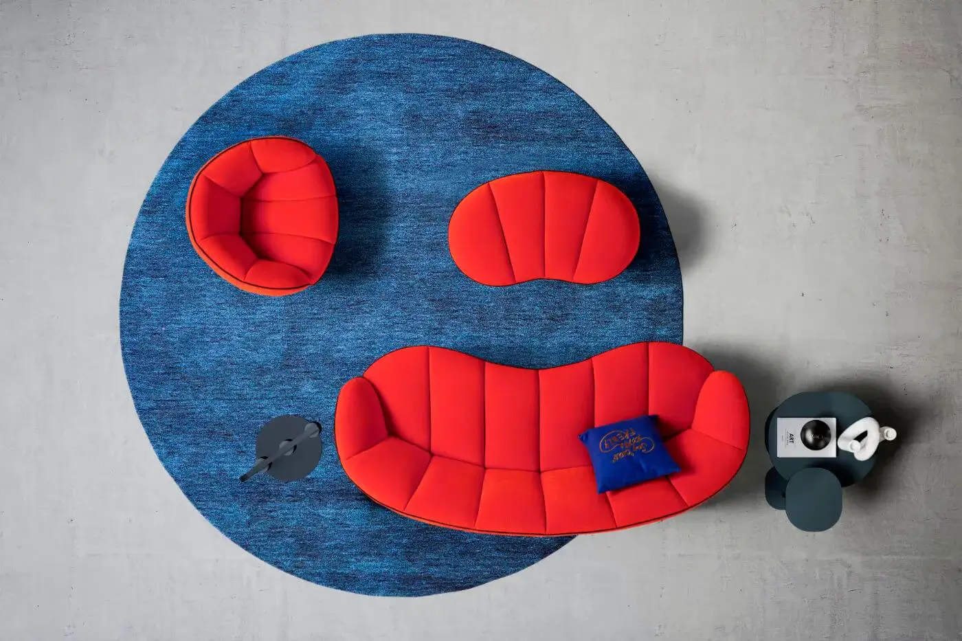 Exceptional Egoitaliano Shai sofa with a curved design upholstered in vibrant red bi-elastic fabric and distinctive vertical stitching
