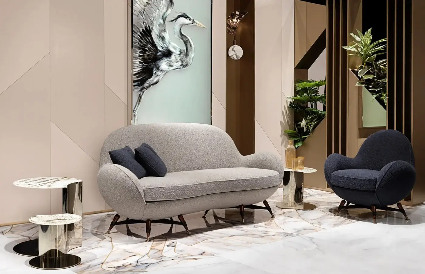 Elegant Visionnaire Mercury sofa with gently curved form upholstered in textured light gray stretch fabric and matte black steel base