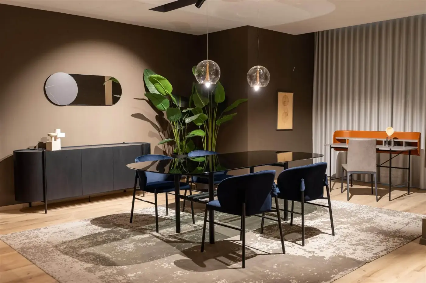 Elegant Dallagnese Supernova table with dark transparent glass top and slender matte black metal frame