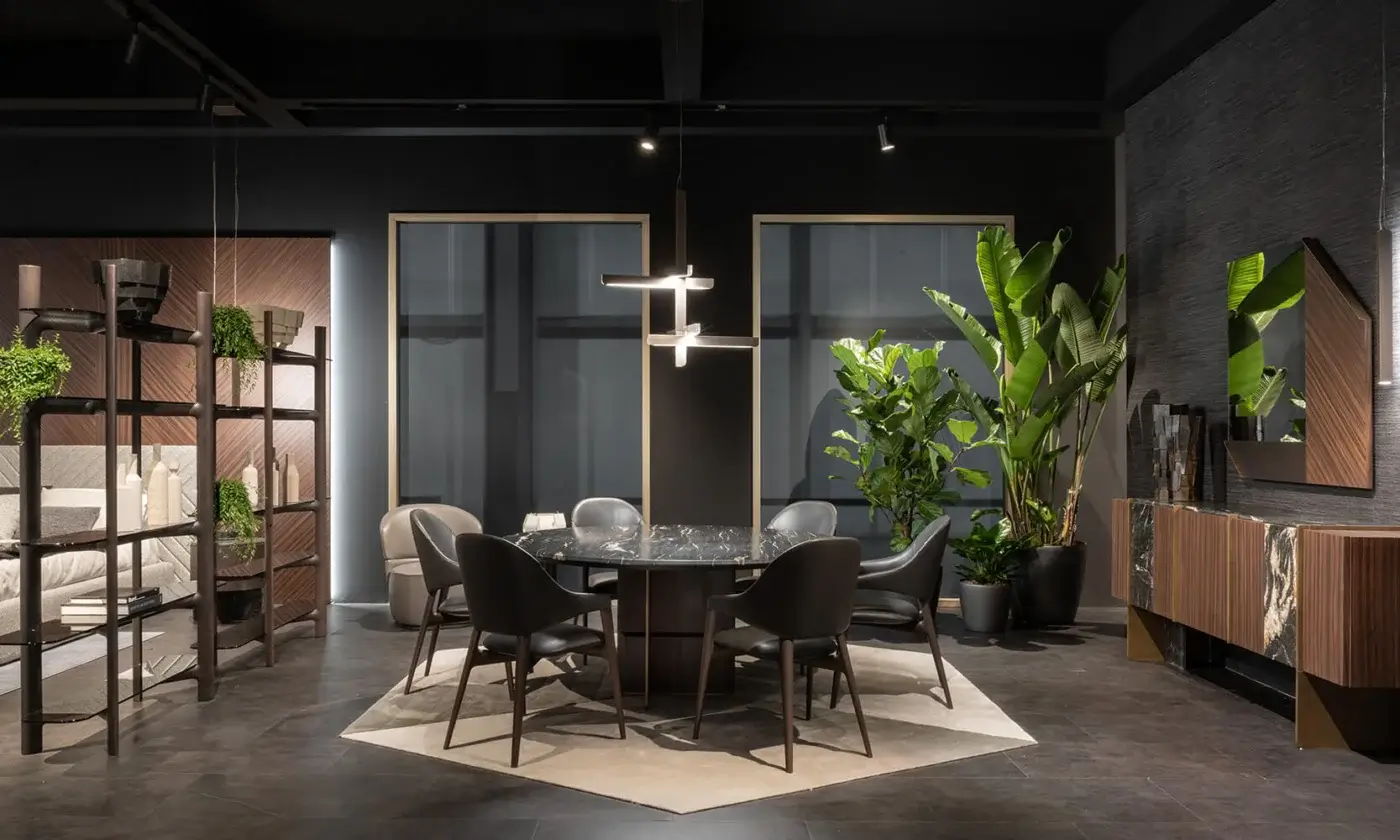 Superior Zanaboni Egle armchair crafted with sculptural solid wood and premium leather in a dark gray textile finish