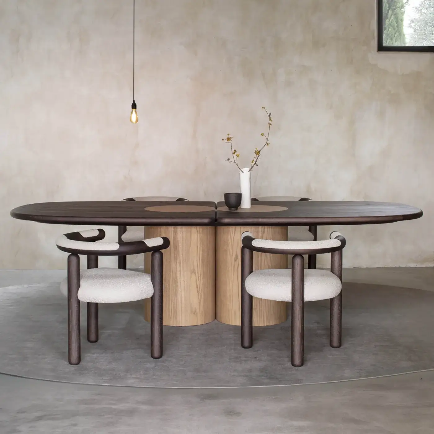 Elegant Carpanese Home Ladybug table crafted in dark matte-finished ash wood with lighter toned cylindrical supports