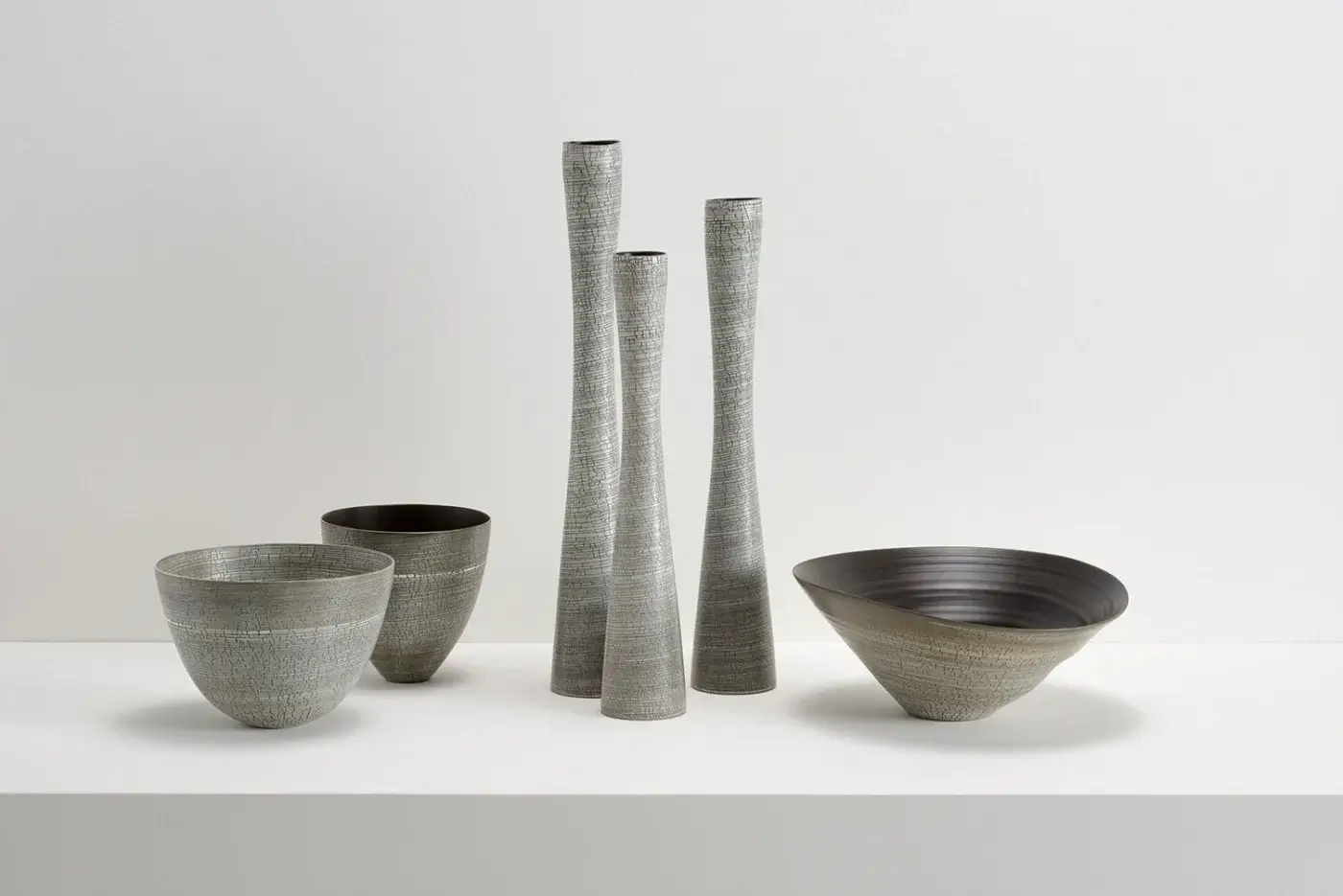 Distinguished Rina Menardi Ciotole bowls crafted from baked clay with a muted gray and subtly mottled texture