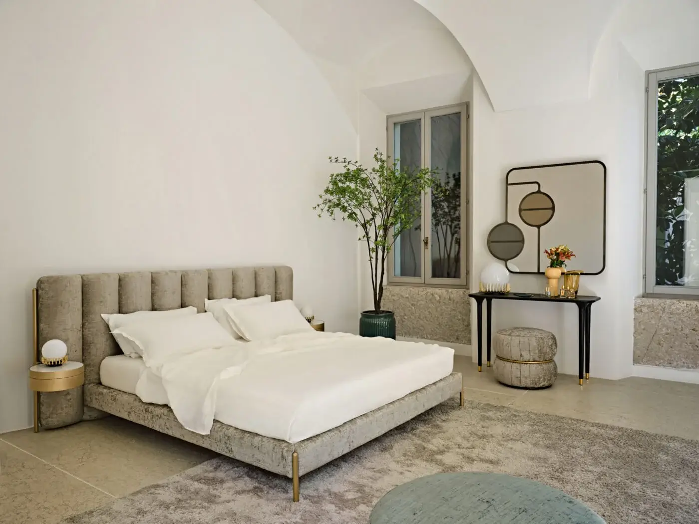 Elegant Black Tie Ibisco bed with sculpted headboard crafted from poplar wood and muted gray-taupe textile upholstery with gold-toned metal legs