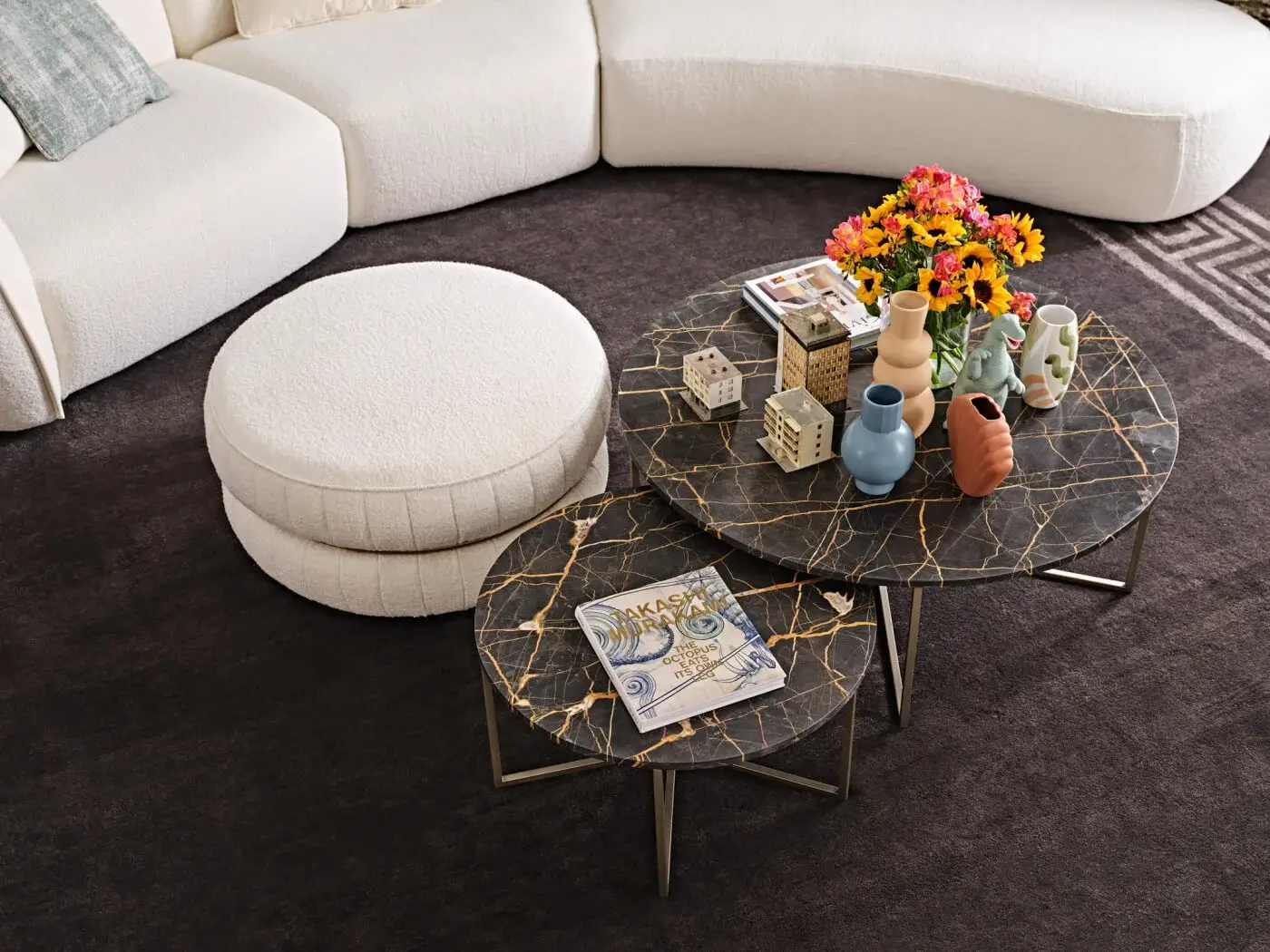 Distinctive Black Tie Lillo ottoman with cream textile upholstery, silver-toned metal base, and dark brown marbled stone inlay
