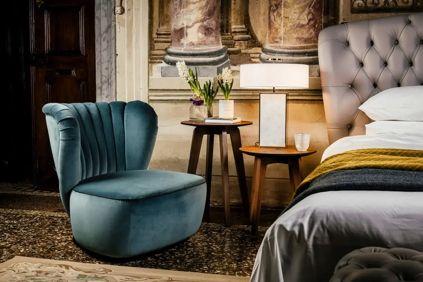 Distinguished Black Tie Amelia lounge chair with enveloping form upholstered in matte velvet and delicately pleated backrest