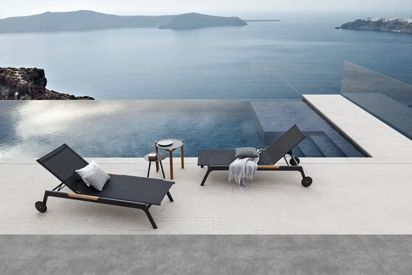 Elegant Atmosphera Nevada chaise lounge with graphite aluminum and dark gray textile offering teak accents