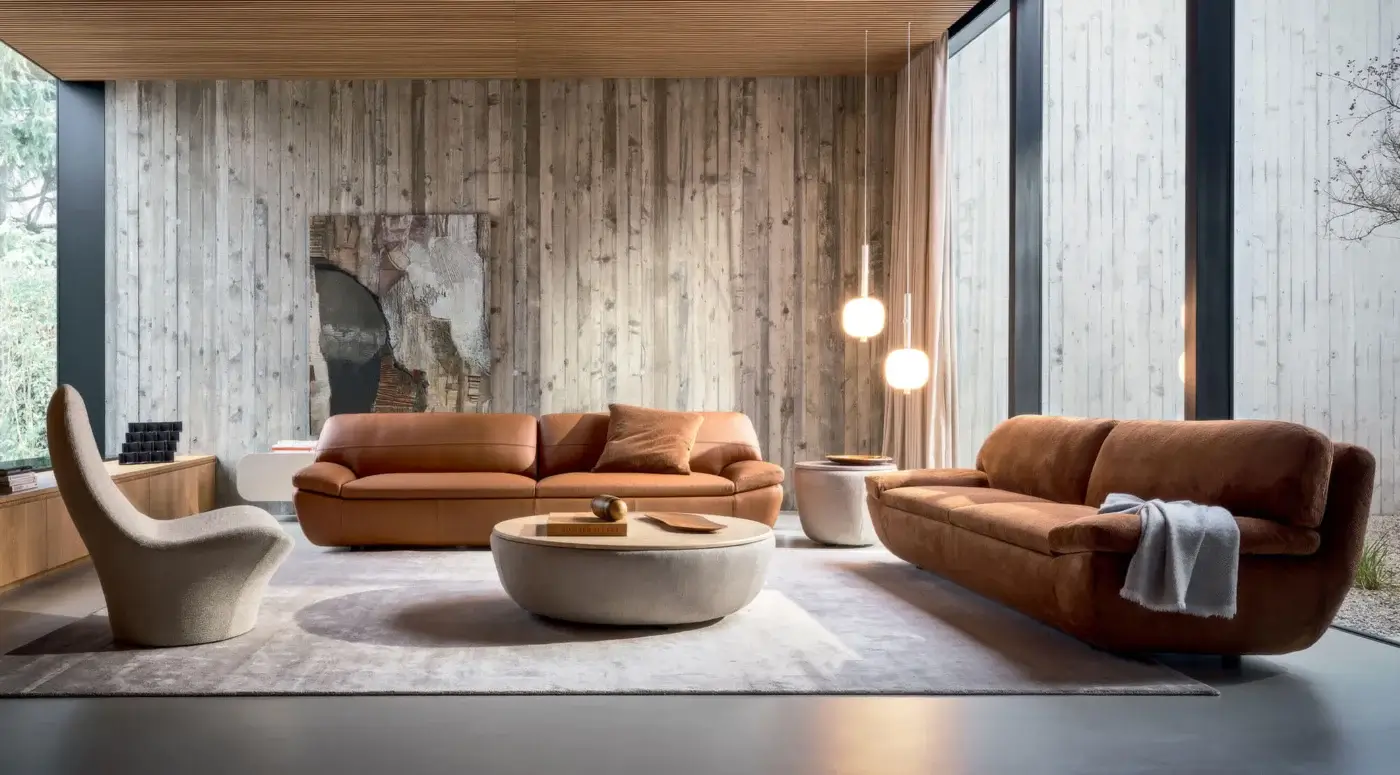 Luxury Ditre Italia Deck coffee table with solid fir framework, smooth‑finished MDF top, textured textile cylinder base, mid‑tone brown wood surface on light grey off‑white upholstered support, contrasting warm timber and neutral fabric, fluid curved lines, low wide silhouette
