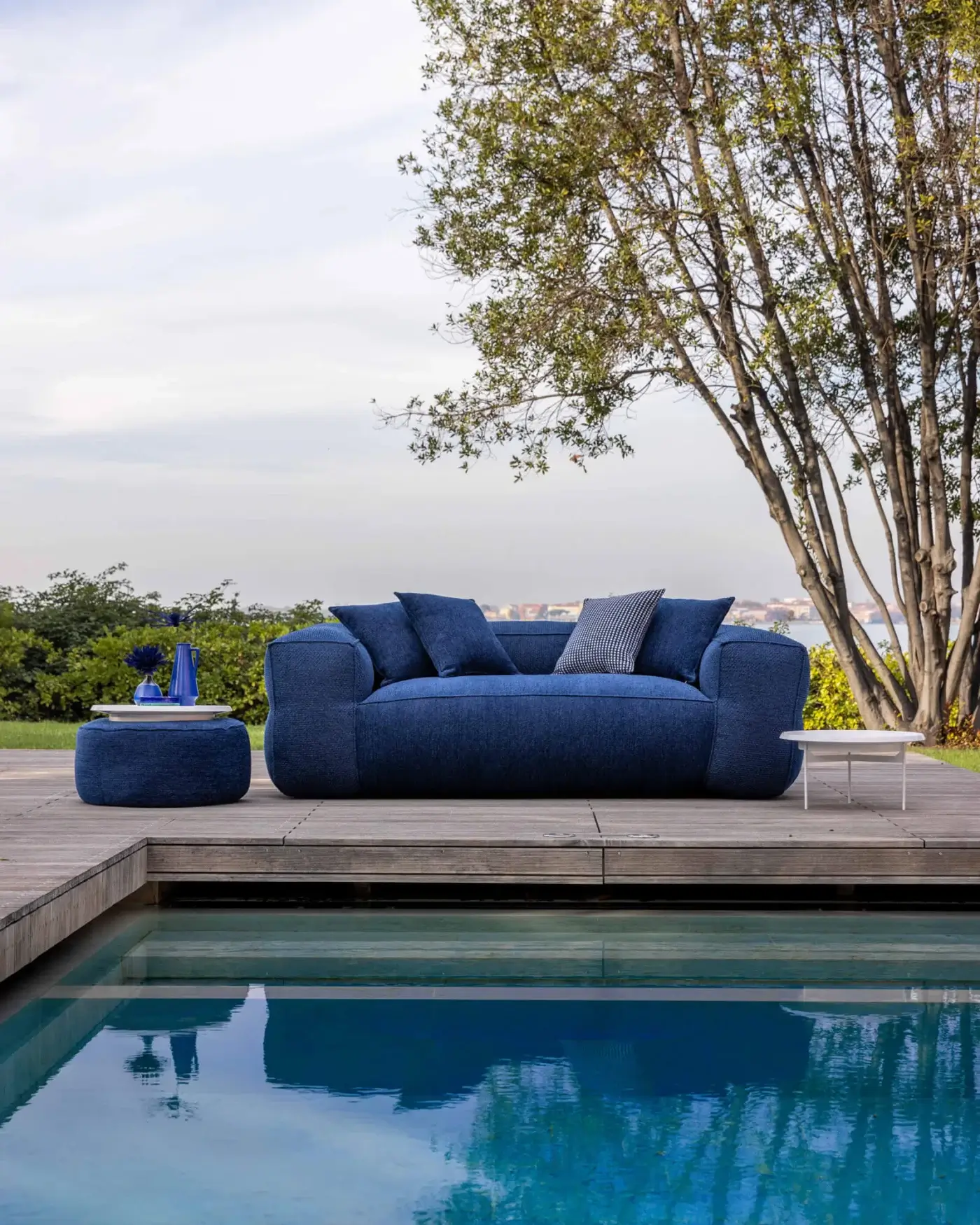Luxury Gart Mediterraneo sofa with deep blue high-performance outdoor fabric cover and rounded organic form
