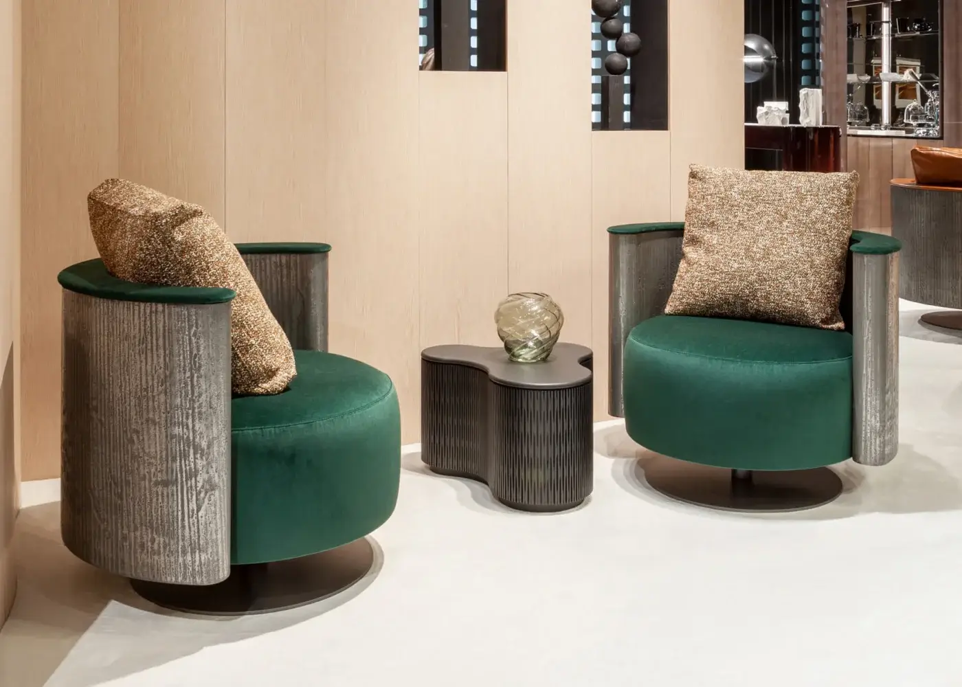 Elegant Laurameroni Amelie chair with liquid-metal shell and emerald-green velvet seat on titanium‑finished matte base