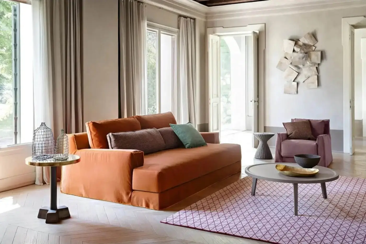 Sophisticated Gervasoni Loll sofa in terracotta matte textured textile with wide armrests and solid wood frame