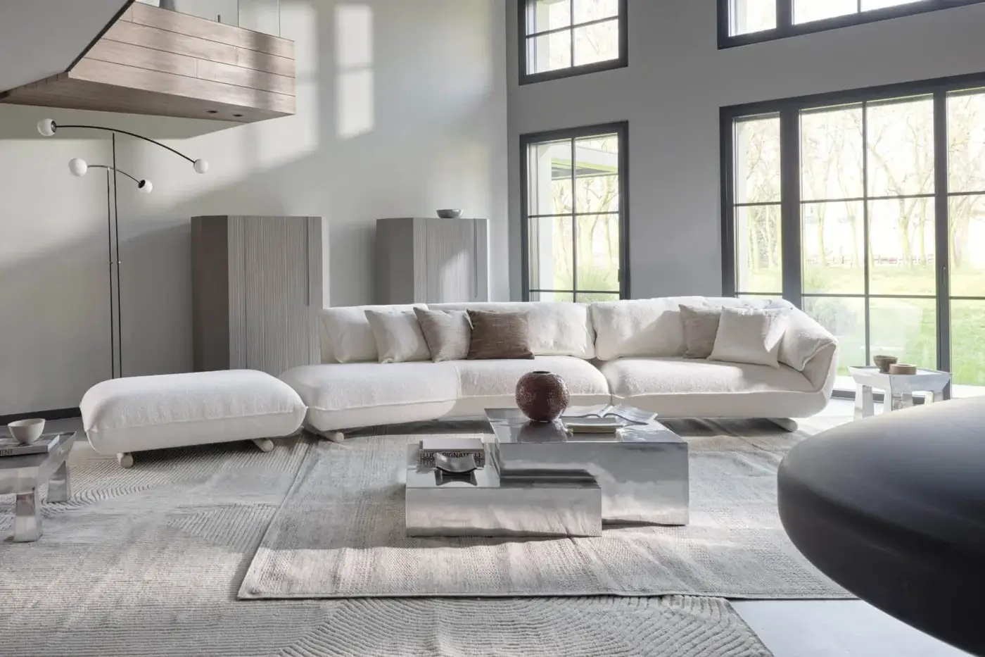 Refined Gervasoni Medley coffee table crafted from polished aluminium with reflective silver finish and sharp lines