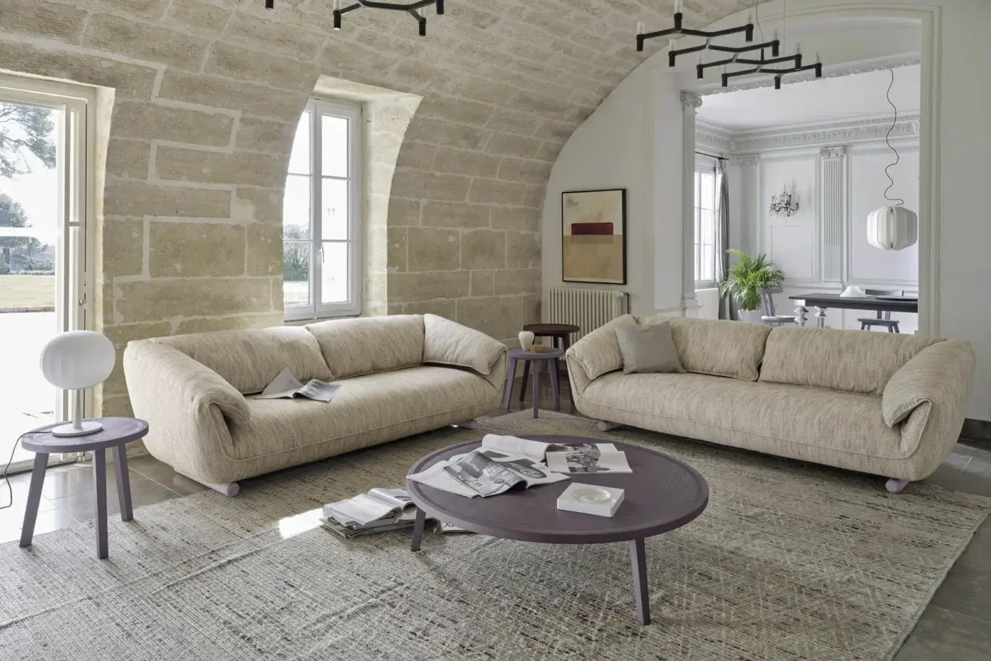 Exquisite Gervasoni Club sofa in light beige textured textile with organic rounded forms and wide rolled arms on ash wood feet