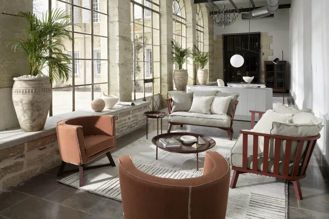 Distinguished Gervasoni Gray 08 lounge chair in light upholstery with a dark reddish-brown finish on sculptural ash wood frame