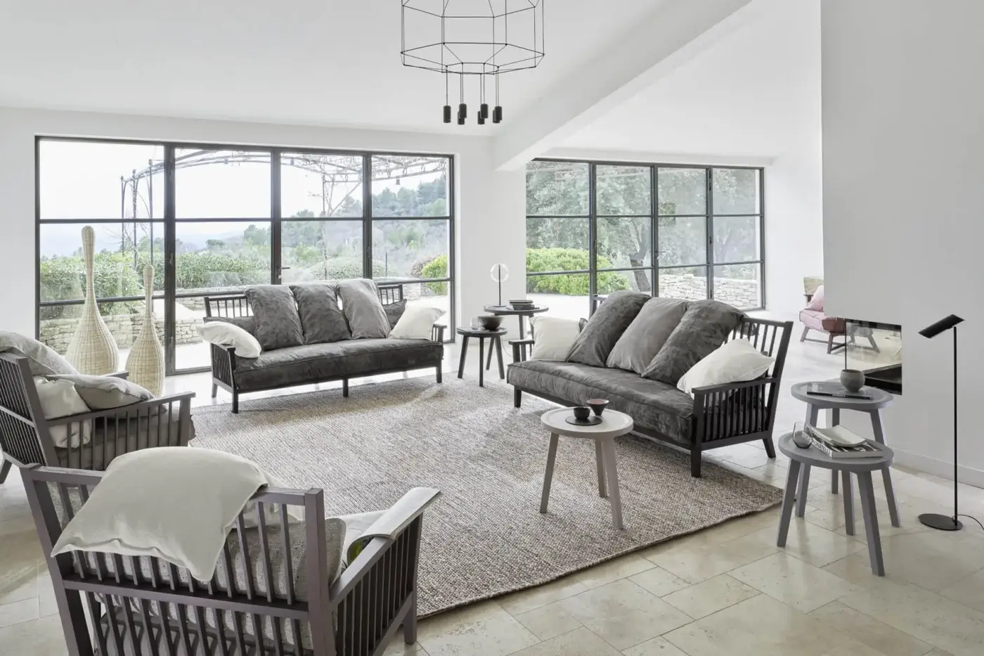 Architectural Gervasoni Gray 01 lounge chair in dark charcoal ash wood with vertical slats and plush dacron down cushions