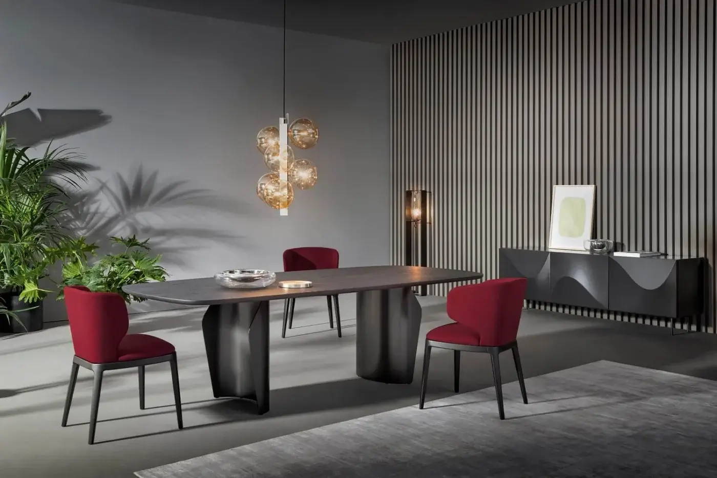 Elegant Bonaldo Flame table with sinuous dark gray ceramic top and sculptural dark metal double base