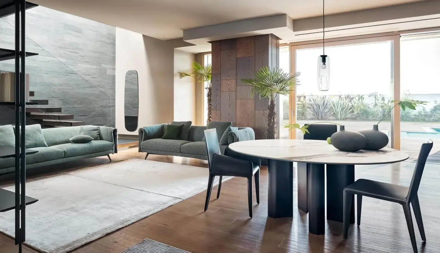 Distinguished Bonaldo Geometric table with a refined round top and sleek base built with painted aluminum or wood and metal profile