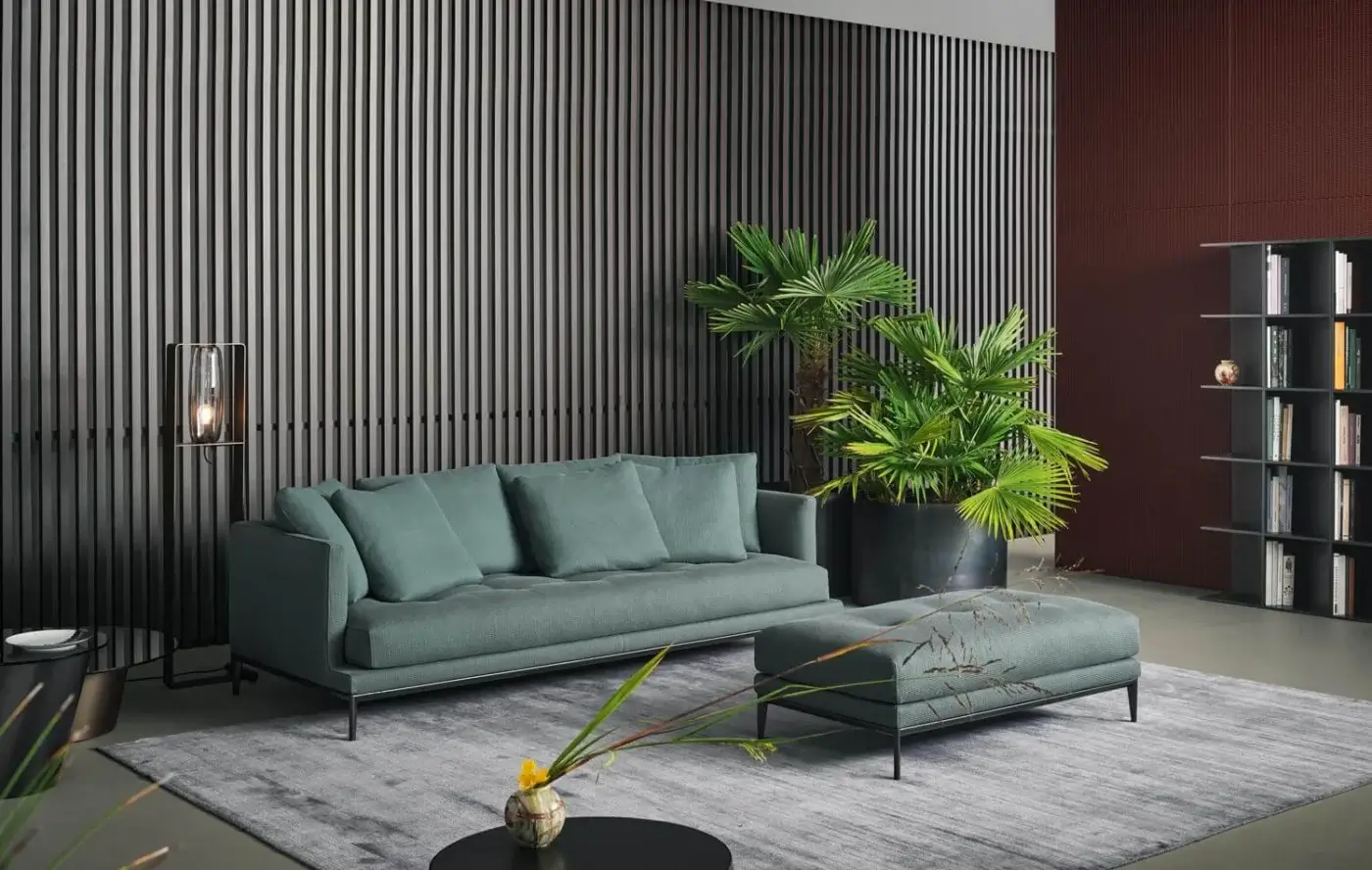 Exceptional Bonaldo Soft Island sofa with muted teal upholstery, deep tufting and a slender dark metal frame