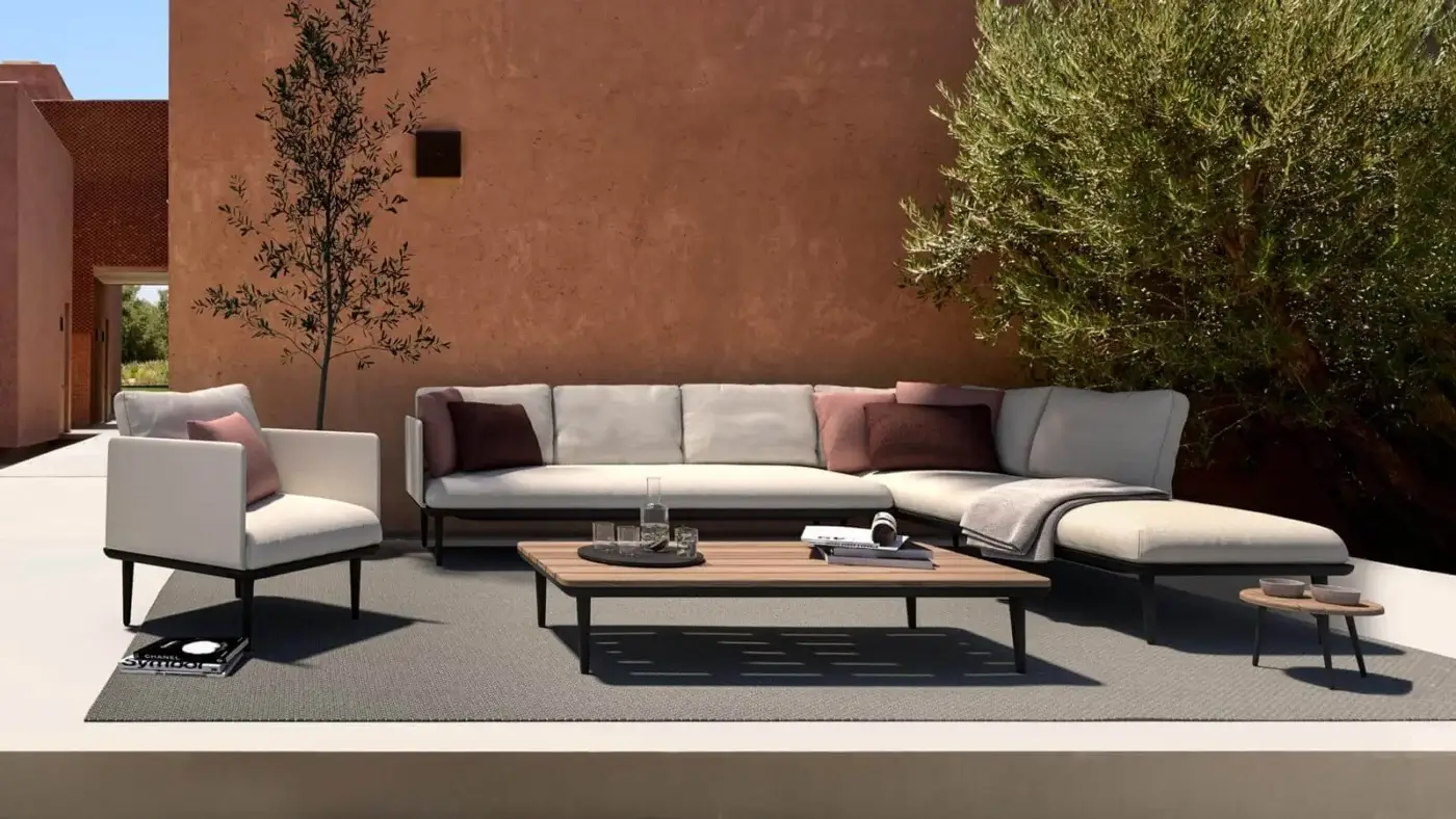 Exclusive Royal Botania Styletto lounge chair with light gray cushioned seat and dark coated aluminum frame