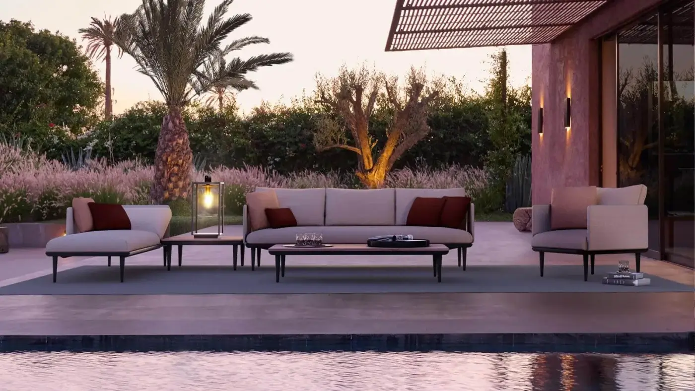 Exclusive Royal Botania Styletto lounge chair with dark coated aluminum frame and light beige fabric cushions complemented by burgundy accents