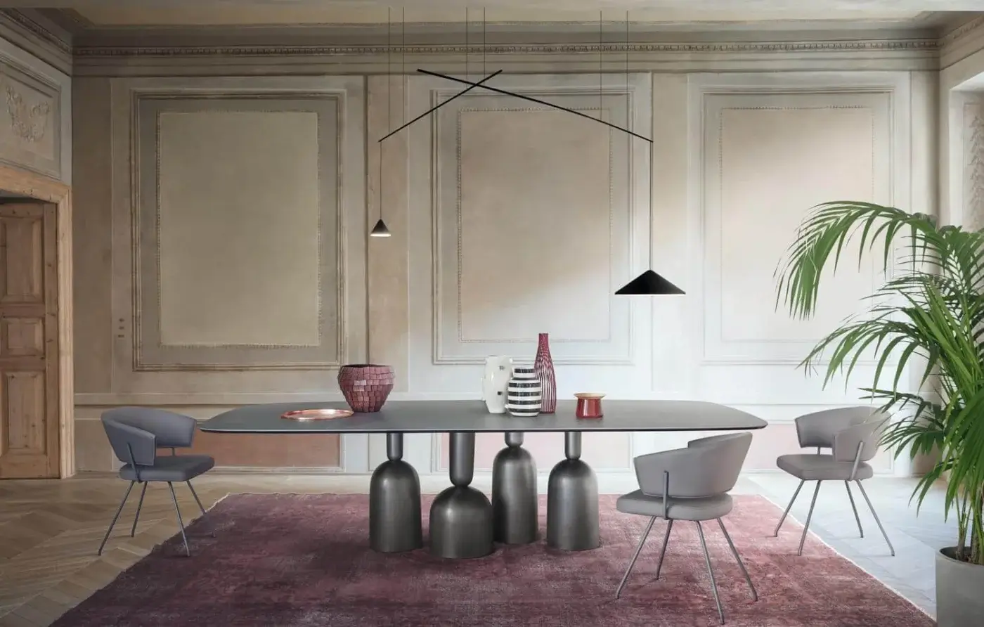 Superior Bonaldo Bahia armchair in light gray matte textile with curved backrest and slender metal legs