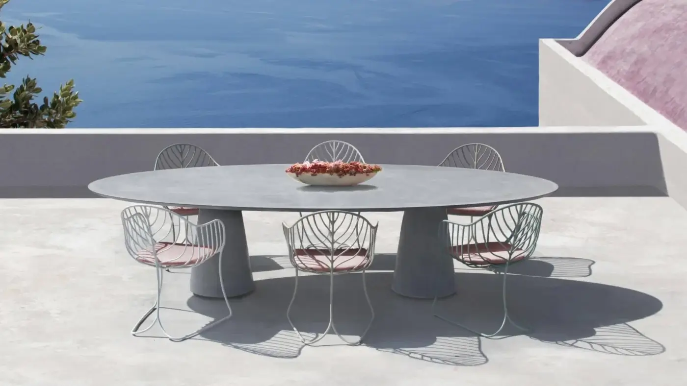 Distinguished Royal Botania Conix table built with polished fibre-reinforced Ductal® concrete and oval gray top