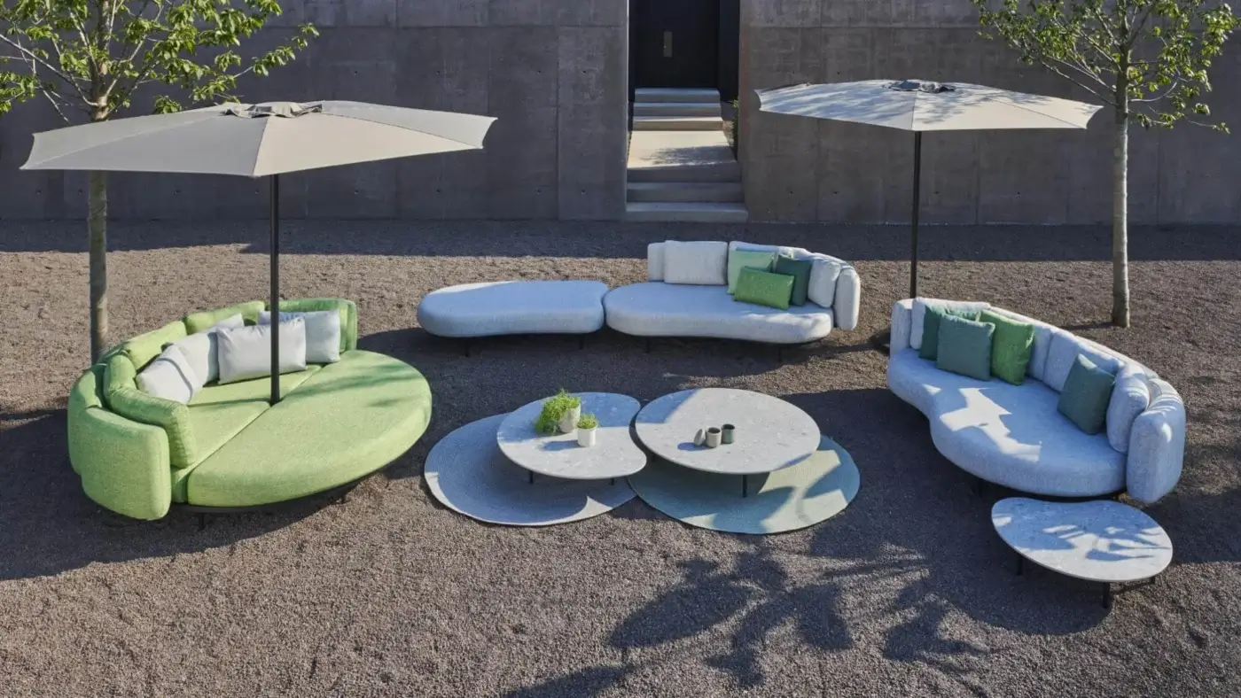 Innovative Royal Botania Palma umbrella table with organically shaped ribs and matte light gray and muted green composite finish