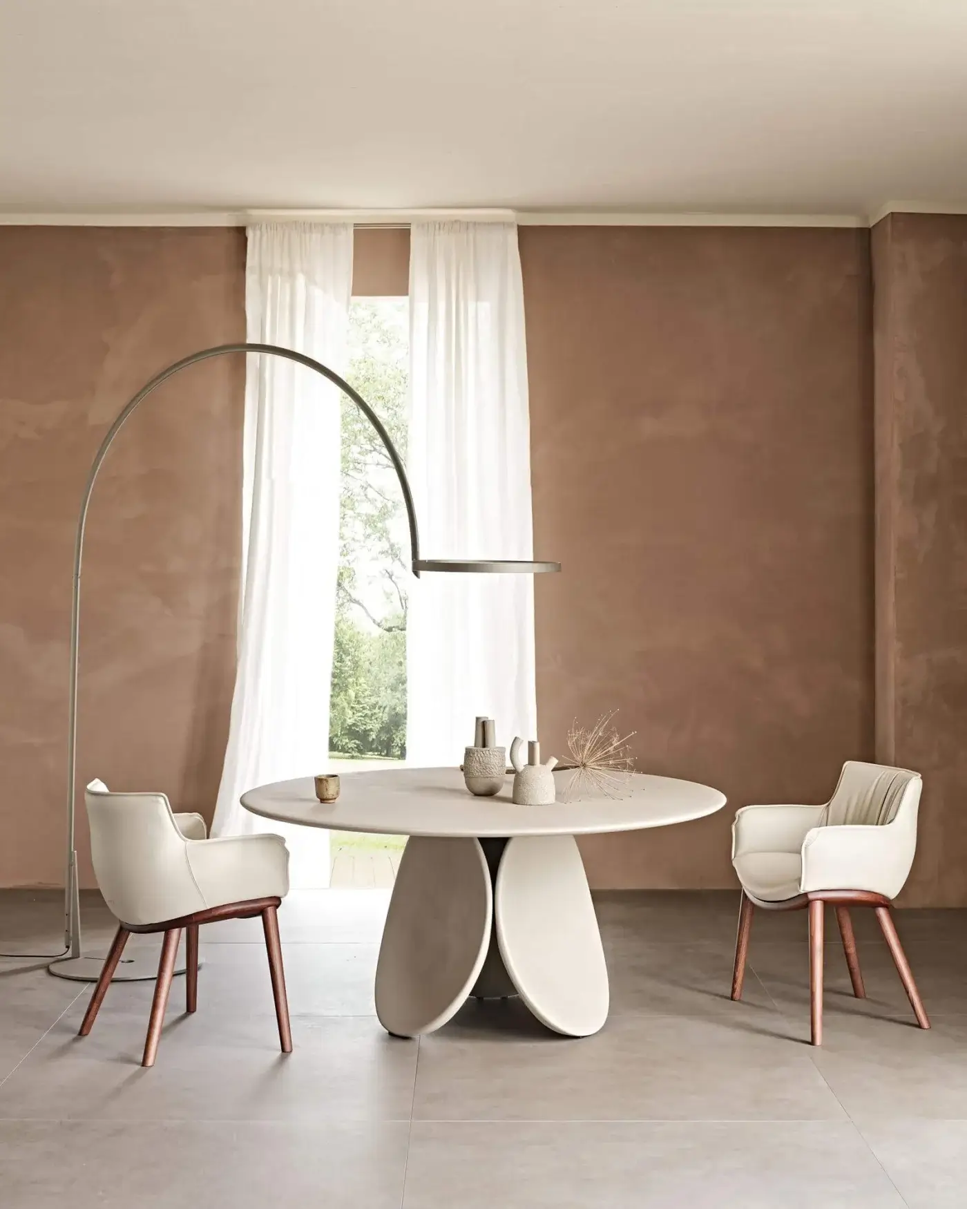 Distinguished Cattelan Italia Rhonda Wood armchair in light cream soft leather with a natural wood base and gently enveloping curves