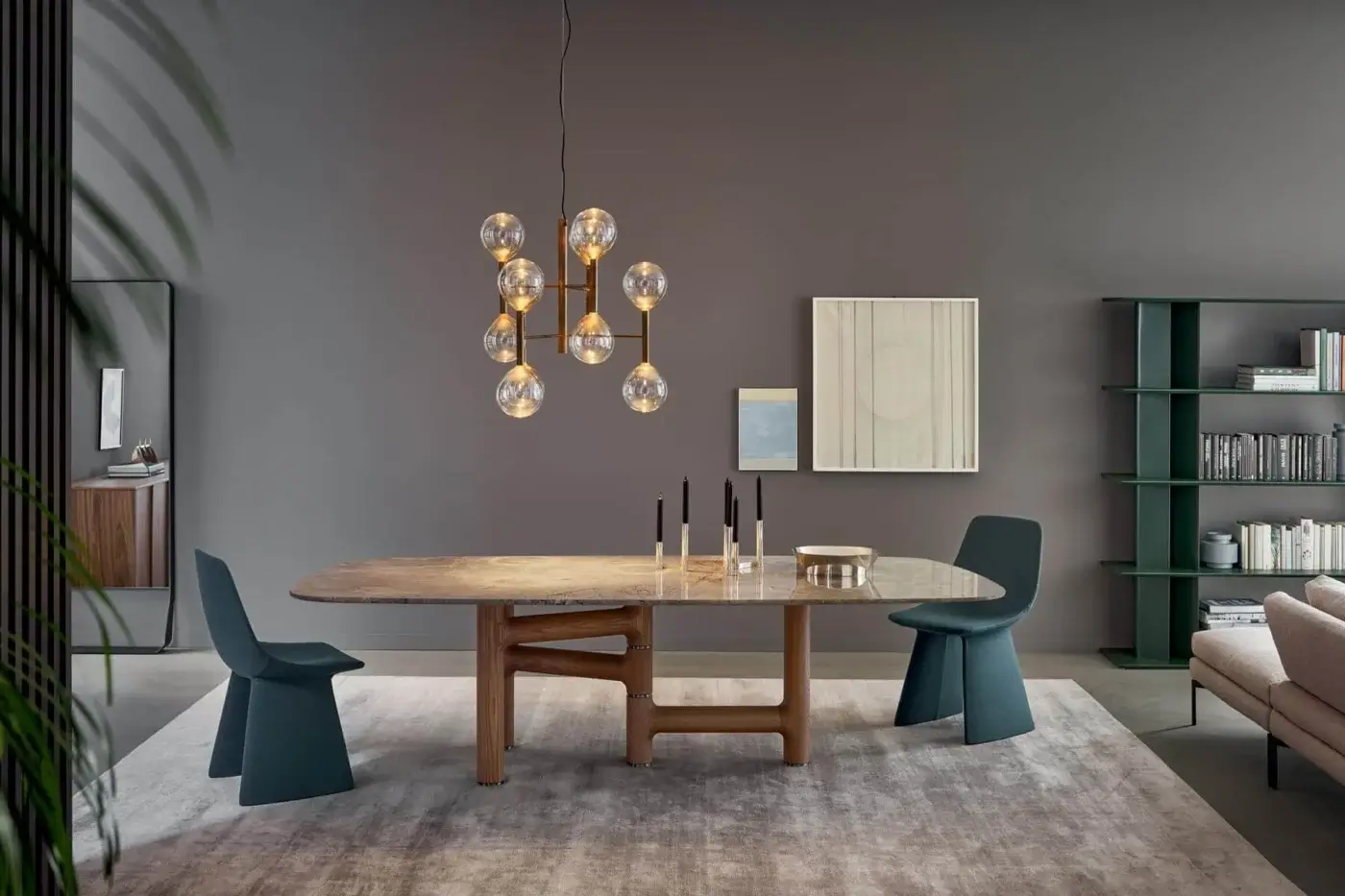 Superior Bonaldo Pivot table with asymmetric solid wood base and refined metal inserts, displaying a light-toned stone-like pattern tabletop