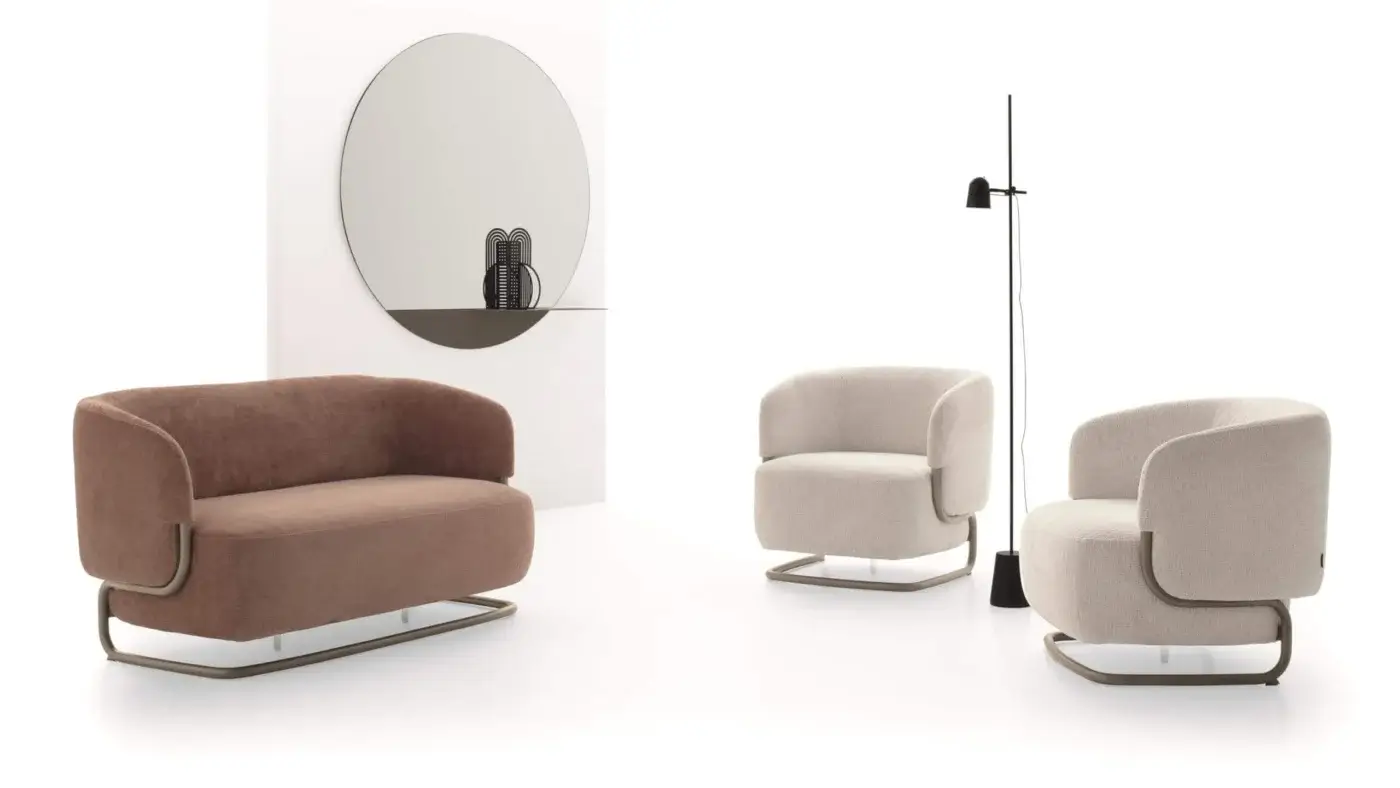 Superior Ditre Italia Marabù lounge chair with a soft seat and curved tubular metal frame upholstered in a light neutral textile