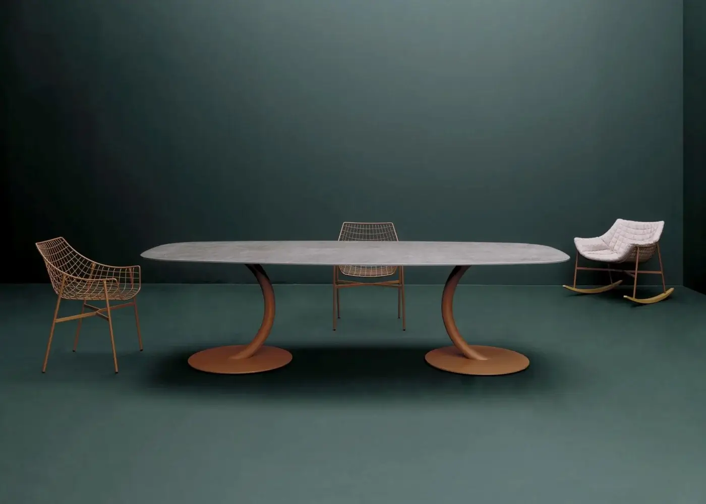 Distinguished Varaschin Flexion table with oval light gray HPL top and gracefully curved orange powder-coated legs