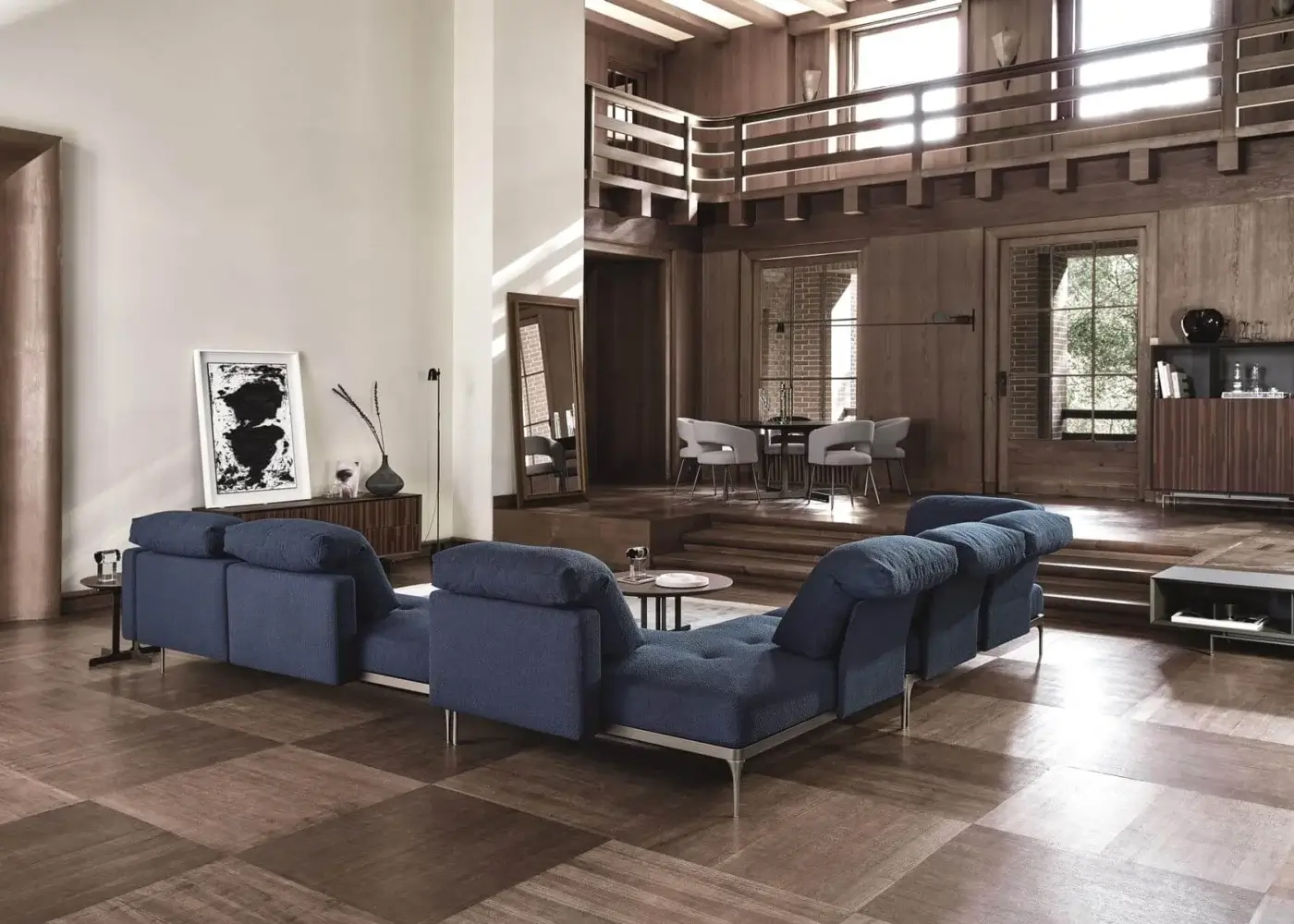 Distinguished Ditre Italia Ada sectional with geometric forms and rounded cushions upholstered in textured blue textile with slender metal legs
