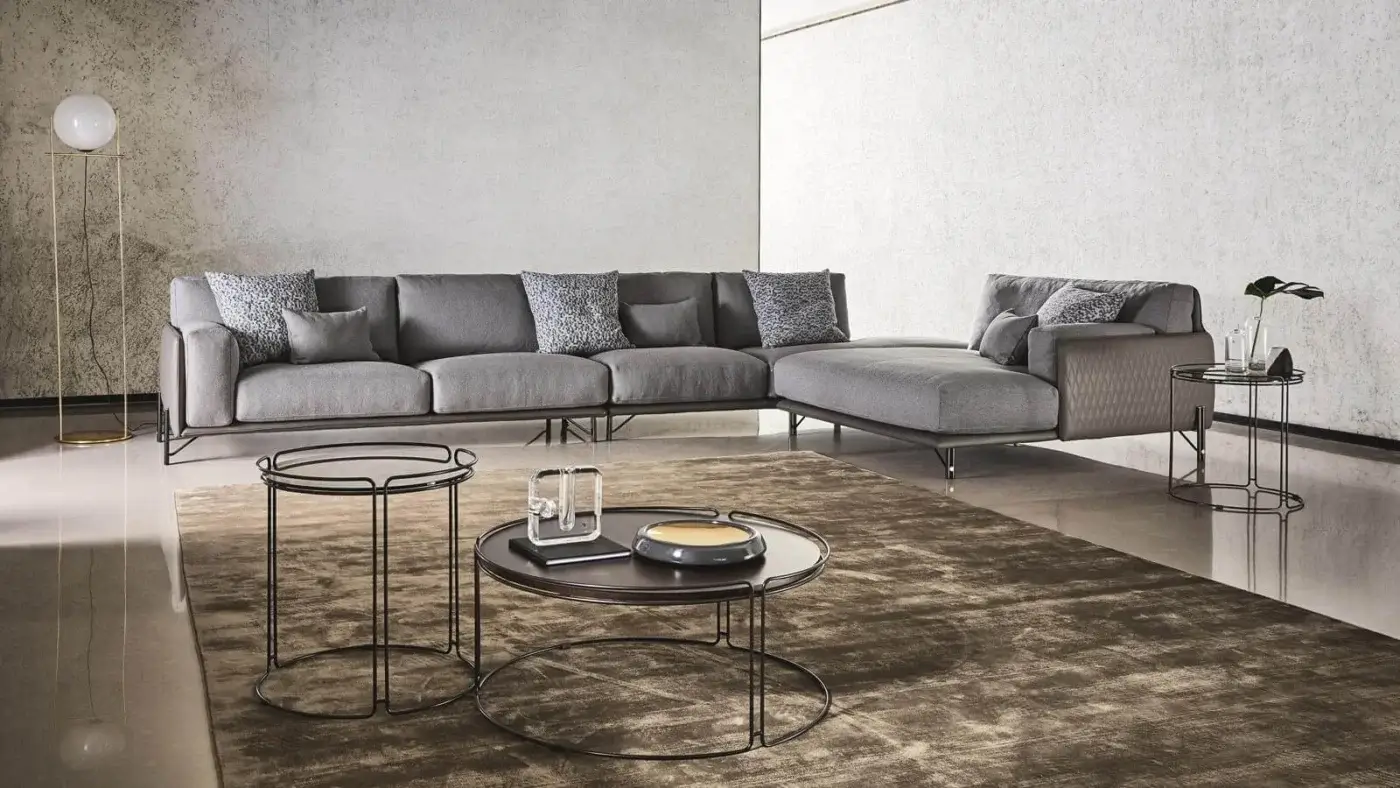 Distinguished Ditre Italia Monolith coffee table with a circular dark tabletop and sleek black metal legs in a matte finish