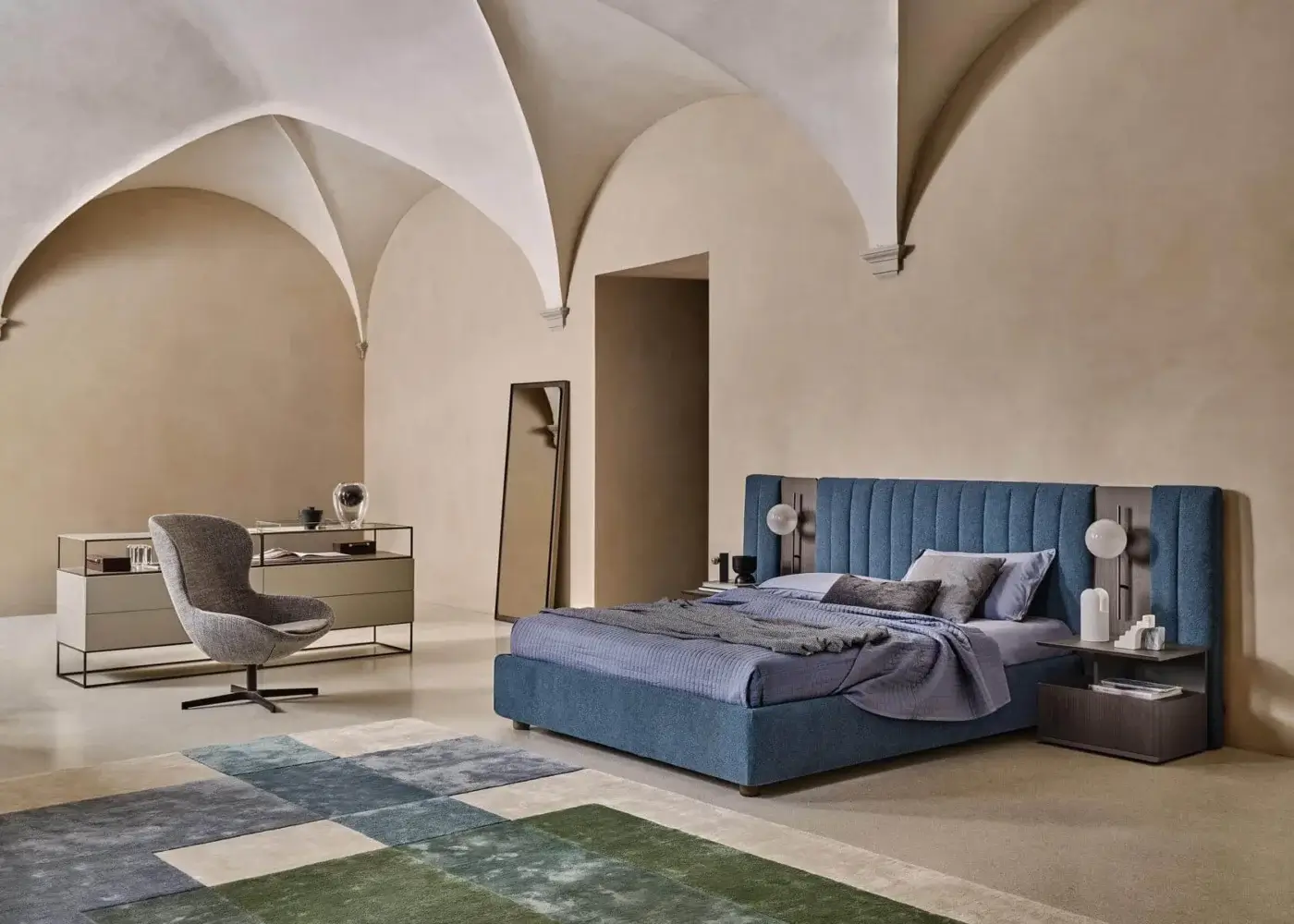 Sophisticated Ditre Italia Round lounge chair with wraparound shape and stylish wooden base in serene blue textile