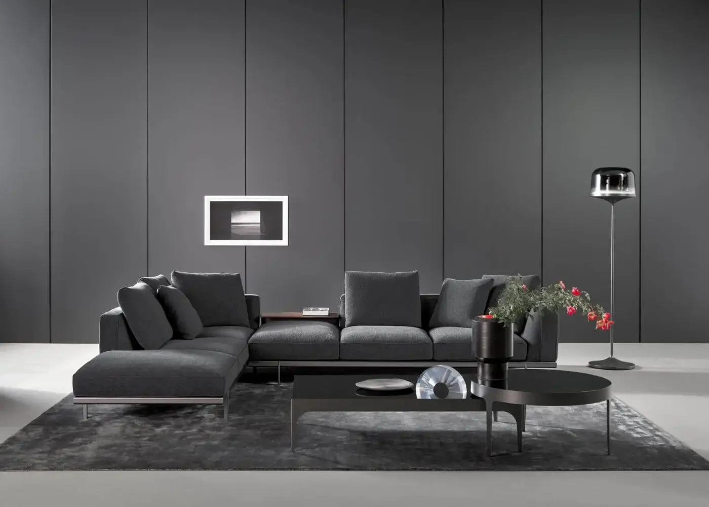Exceptional Bonaldo Phil sectional with dark gray textile upholstery, oval tubing metal base and wood side table