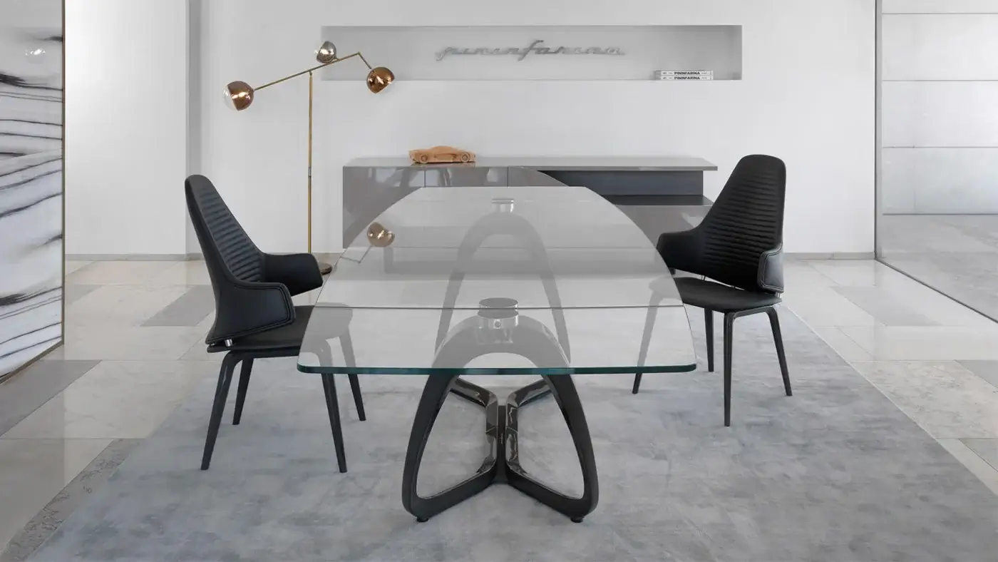 Distinguished Reflex Segno table with transparent glass top and bronze metal mixed material base