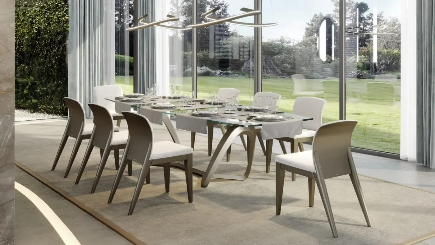Elegant Reflex Segno table with transparent glass top and sculptural base crafted in mixed materials with bronze metal support