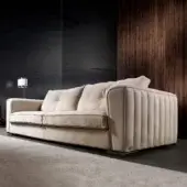 Distinguished DV Home Collection Beverly sofa with light beige textile upholstery and refined vertical quilting
