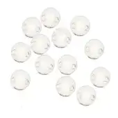 Glass Edison bulb pendants, clear spheres, varying brightness, dynamic cluster arrangement against a white backdrop.