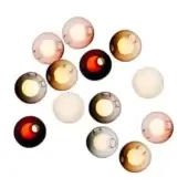 Spherical glass light fixtures in amber, rose, gray, and white tones are arranged on a white background, featuring circular openings and warm internal lighting.