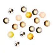 Spherical wall lights in clear, amber, yellow, brown & pink glass are clustered on white, featuring circular openings & gradient tones.