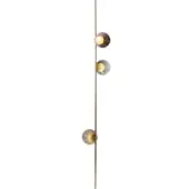 Floor lamp, brass finish, with three amber glass shades vertically aligned on a slender rod, black cord and plug.