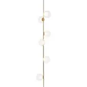 Floor lamp, brass pole with eight milky white glass globes, slender vertical design, black cord, studio product shot.
