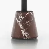 Marble table base, reddish-brown with white veining, conical form and black cylindrical stem, polished finish, studio lighting.