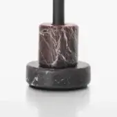 Low table base, dark gray marble, stacked cylindrical forms with red veining and a matte black metal support rod.
