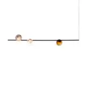 Pendant light fixture, black metal rod, three spherical glass pendants, warm amber and peach tones, varying textures.