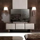Exclusive DV Home Collection Elite TV stand with light cream leather front and warm wood grain top supported by polished metal legs